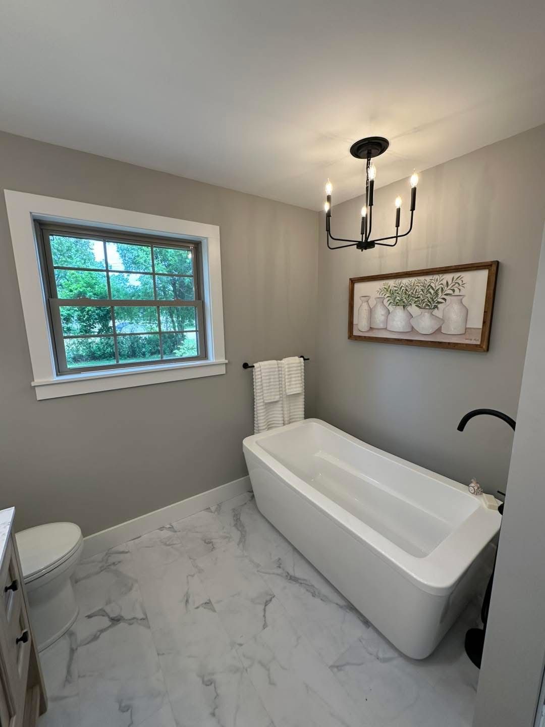 Remodeled bathroom with freestanding tub